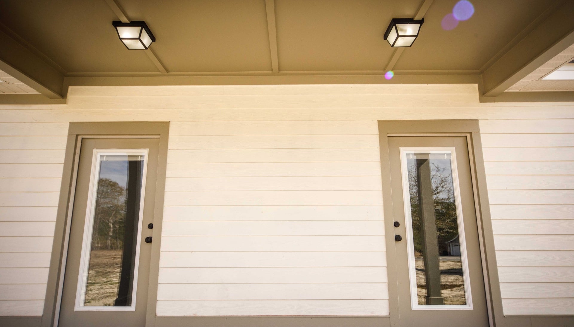 We offer siding services in Panama City, Florida. Hardie plank siding installation in a front entry way.